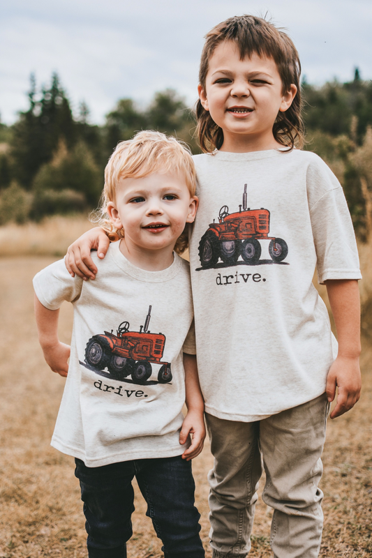 “drive.” Tractor Tee